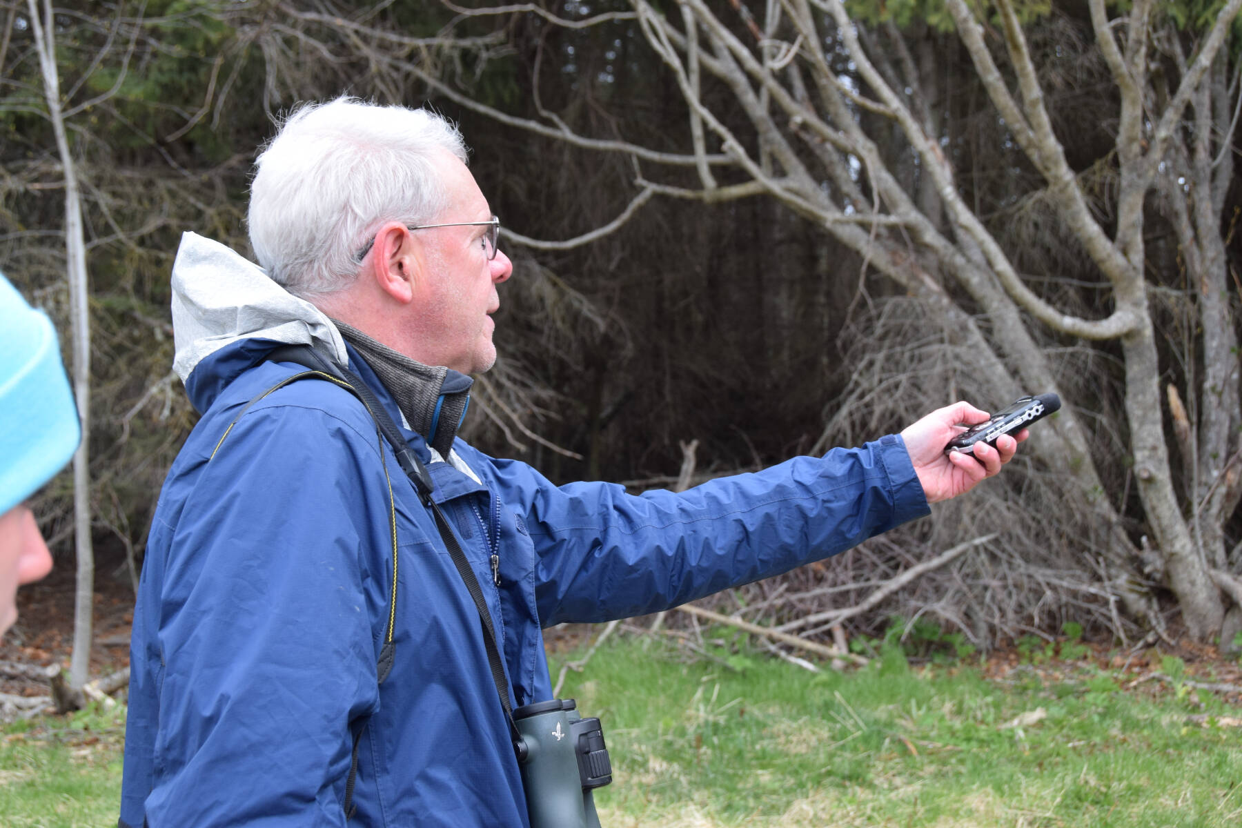 2024 Kachemak Bay Shorebird Festival keynote speaker Ted Floyd records the call of a fox sparrow near the Beluga Slough Trail on Friday, May 10, 2024, in Homer, Alaska. (Delcenia Cosman/Homer News)