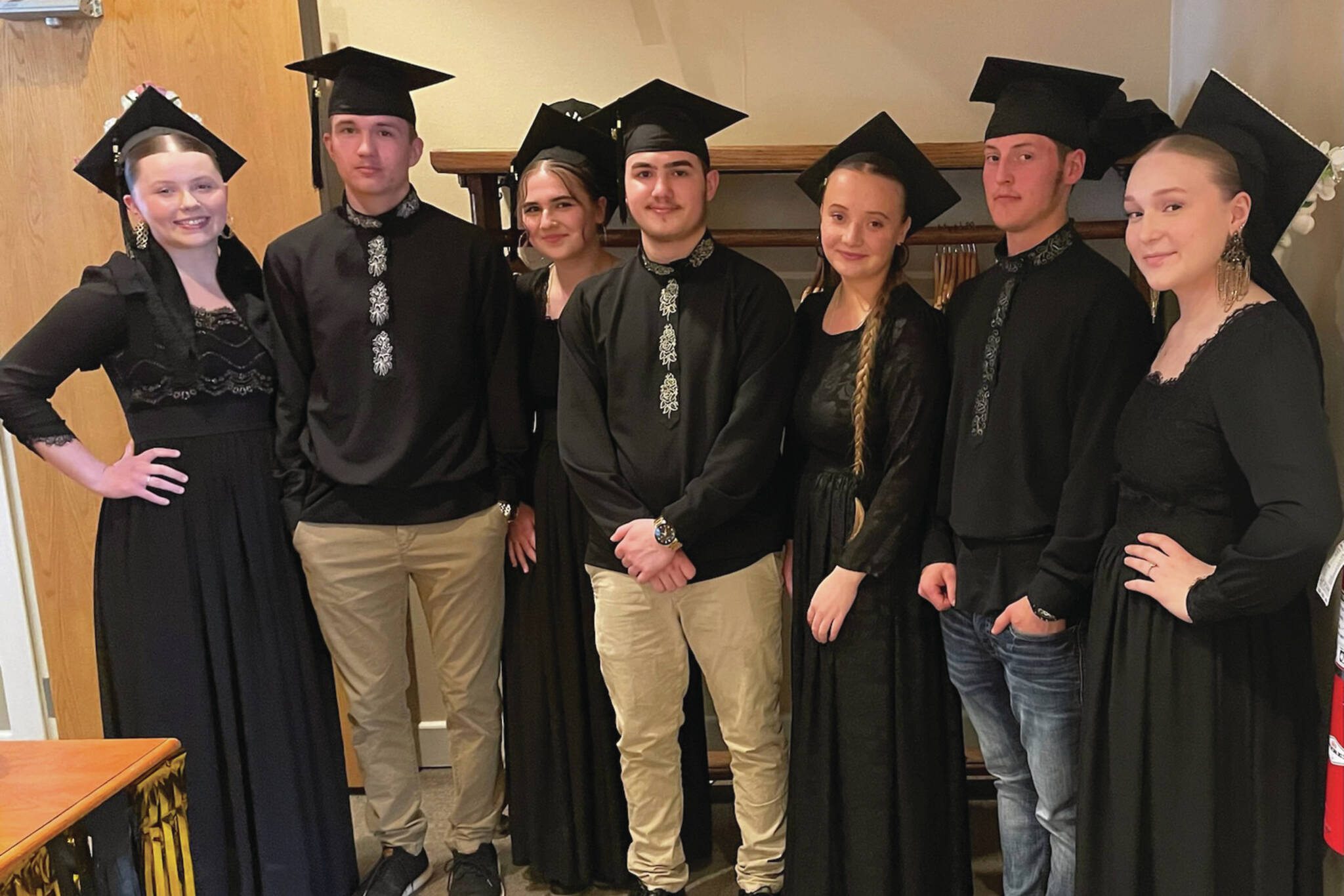 Seniors from Voznesenka and Kachemak Selo prepare to enter the graduation ceremony at Land’s End Resort, Thursday, May 16, 2024, in Homer, Alaska. (Emilie Springer/Homer News)