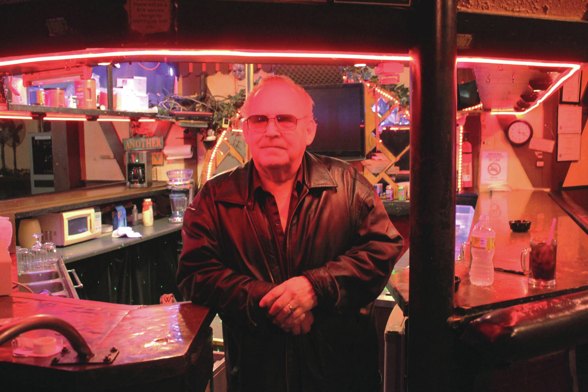 Charlie Cunningham stands behind the bar at Good Time Charlies on Monday, Aug. 1, 2022 in Soldotna, Alaska. (Ashlyn O'Hara/Peninsula Clarion)