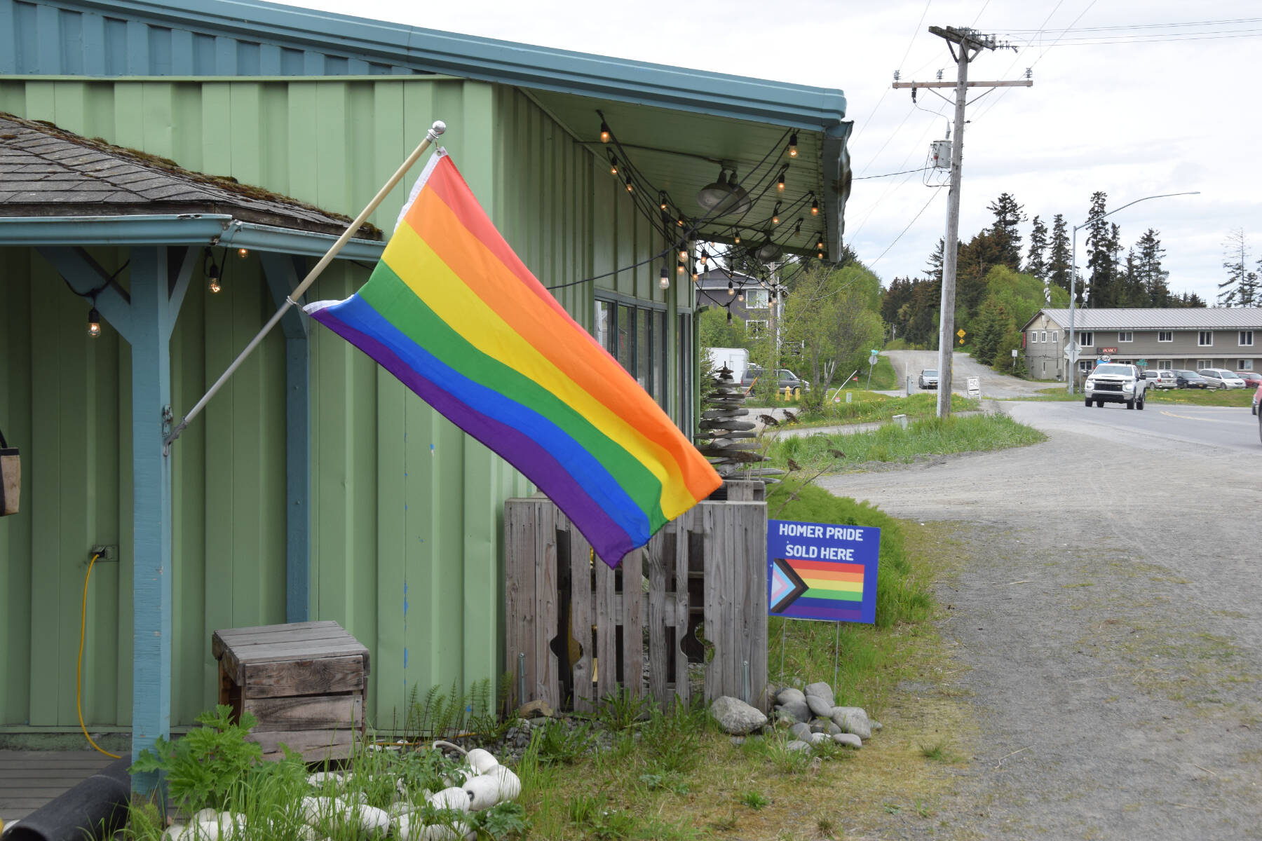 Sustainable Wares, photographed on Saturday, June 1, 2024 on Ocean Drive in Homer, Alaska, advertises Homer Pride merchandise for sale. (Delcenia Cosman/Homer News)