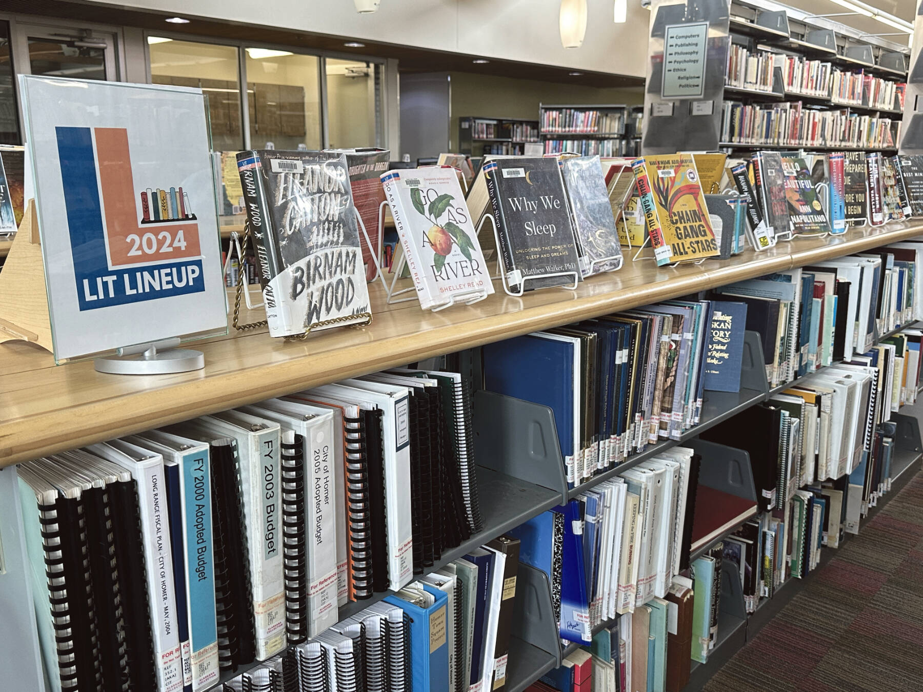 The Lit Lineup Bookshelf at the Homer Public Library is photographed on April 19, 2024, in Homer, Alaska. Photo by Christina Whiting