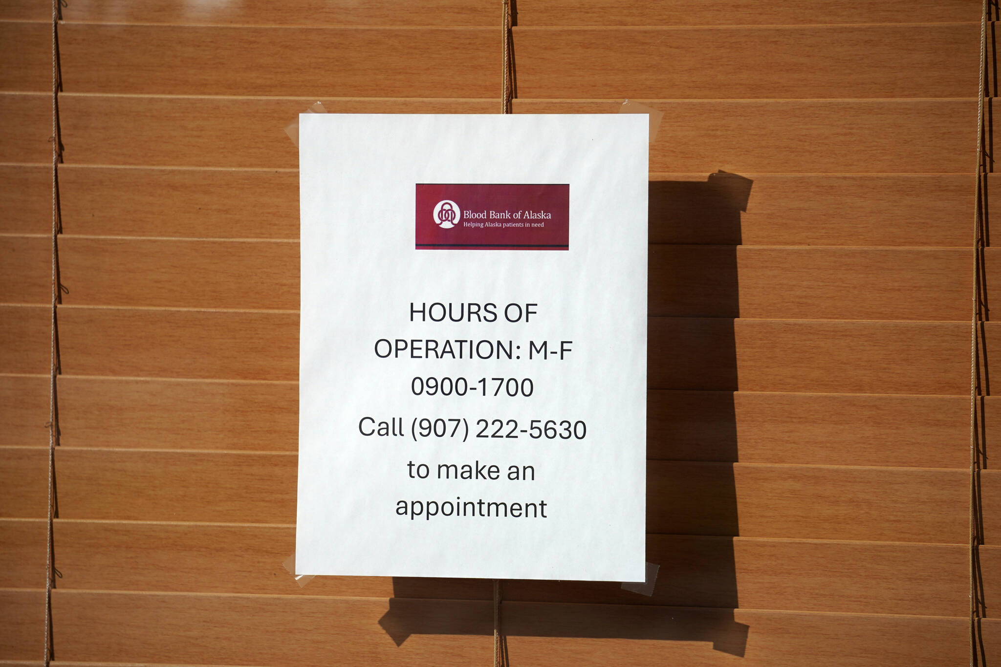 A sign shows hours of operation for the Blood Bank of Alaska’s new Kenai Peninsula center in Soldotna, Alaska, on Monday, June 17, 2024. (Jake Dye/Peninsula Clarion)