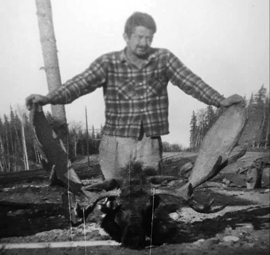Jack Griffiths stands over the head of a bull moose, probably in the 1950s. (Public photo from familysearch.org)