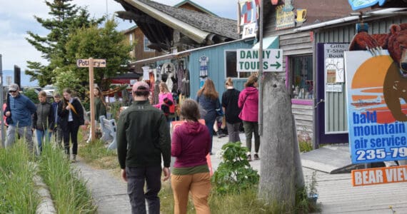 Visitors browse the shops along the Homer Spit on Friday, June 28, 2024, in Homer, Alaska. (Delcenia Cosman/Homer News)