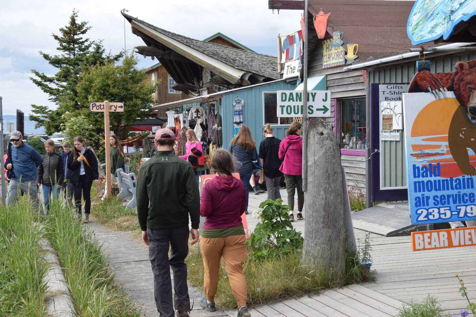 Visitors browse the shops along the Homer Spit on Friday, June 28, 2024, in Homer, Alaska. (Delcenia Cosman/Homer News)