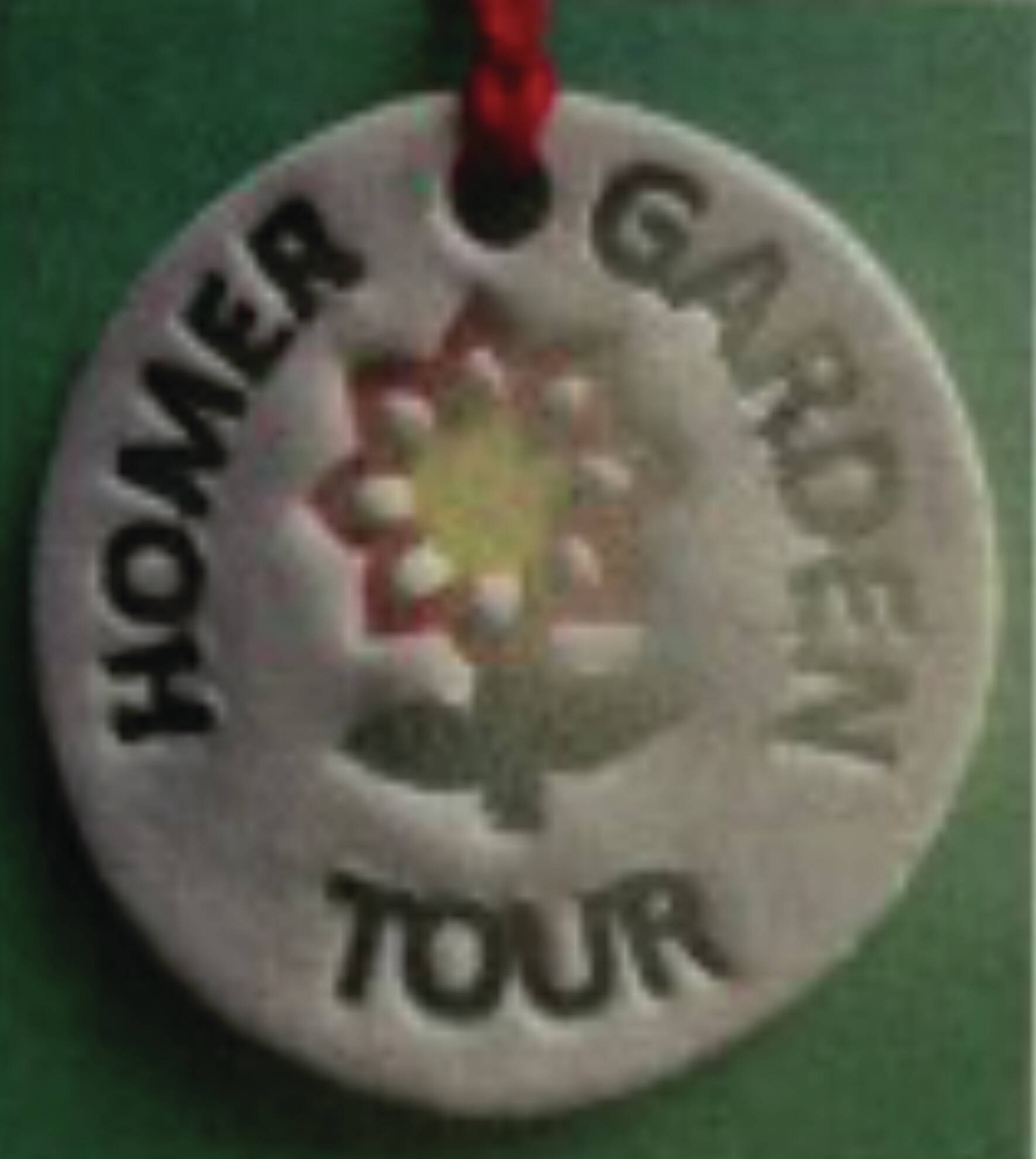 Jeff Szarzi Pottery assisted with this year's Garden Club Tour pendants.