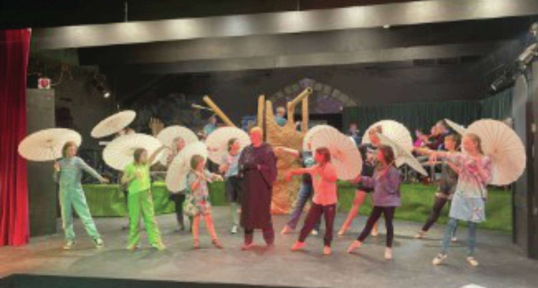 Cast members for the Addams Family rehearse the dance piece 'The Moon and Me,' where Uncle Fester played by Regi Johanos confesses he is in love with the moon, at the the Pier One Theatre on the Spit on July 8, 2024.  Emilie Springer, Homer News.