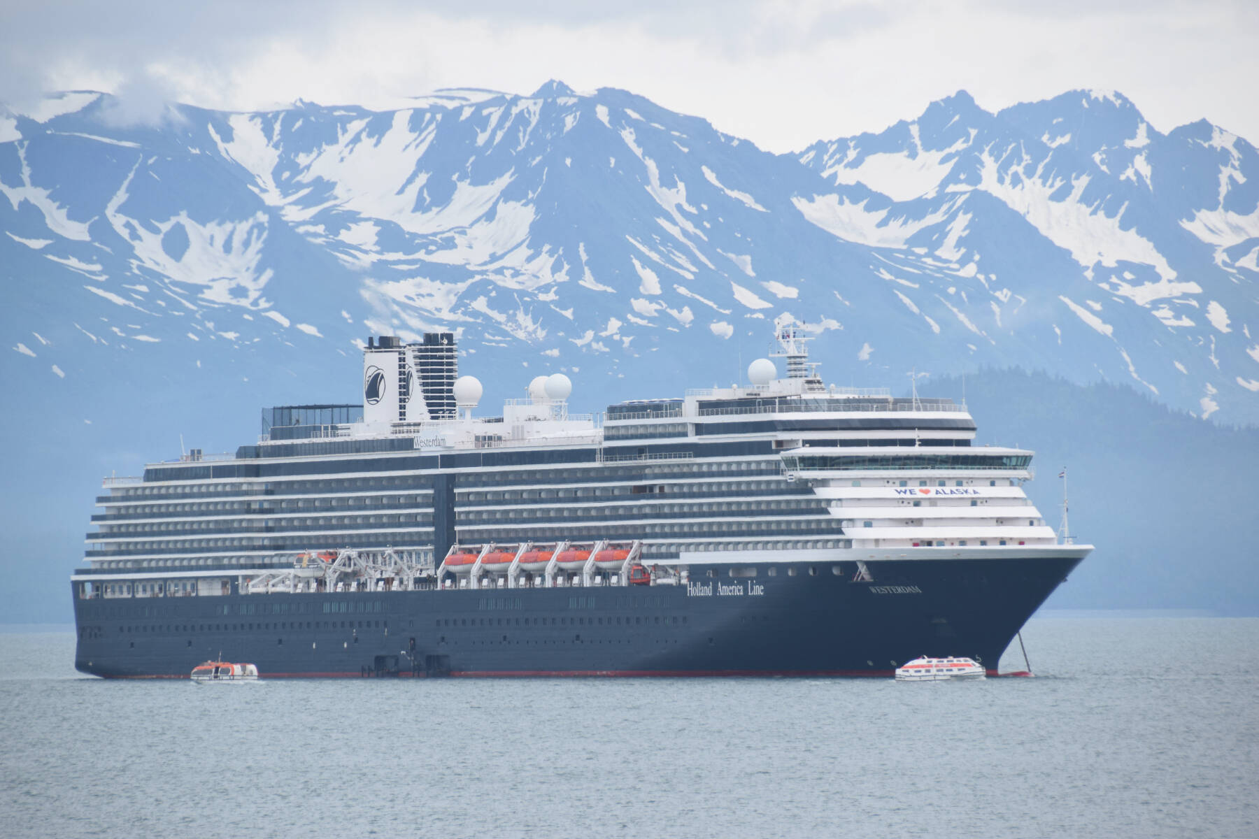 The MS Westerdam, from the Holland America cruise line, is anchored out in Kachemak Bay on Friday, June 28, 2024, in Homer, Alaska. Too large in both linear feet and displacement tonnage, the Westerdam was unable to dock at the Homer Harbor and was instead required to lighter their nearly 2,000 passengers into the harbor using their smaller lifeboats. (Delcenia Cosman/Homer News)