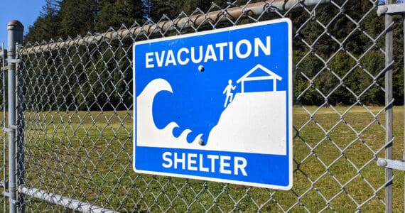 A tsunami evacuation sign is seen in Seldovia Village, Alaska, on Sept. 27, 2021. (Photo by Erin Thompson/Peninsula Clarion)