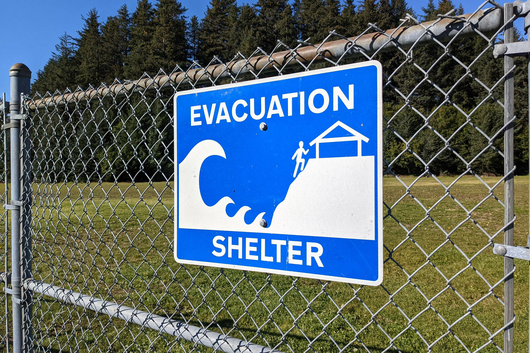 A tsunami evacuation sign is seen in Seldovia Village, Alaska, on Sept. 27, 2021. (Photo by Erin Thompson/Peninsula Clarion)