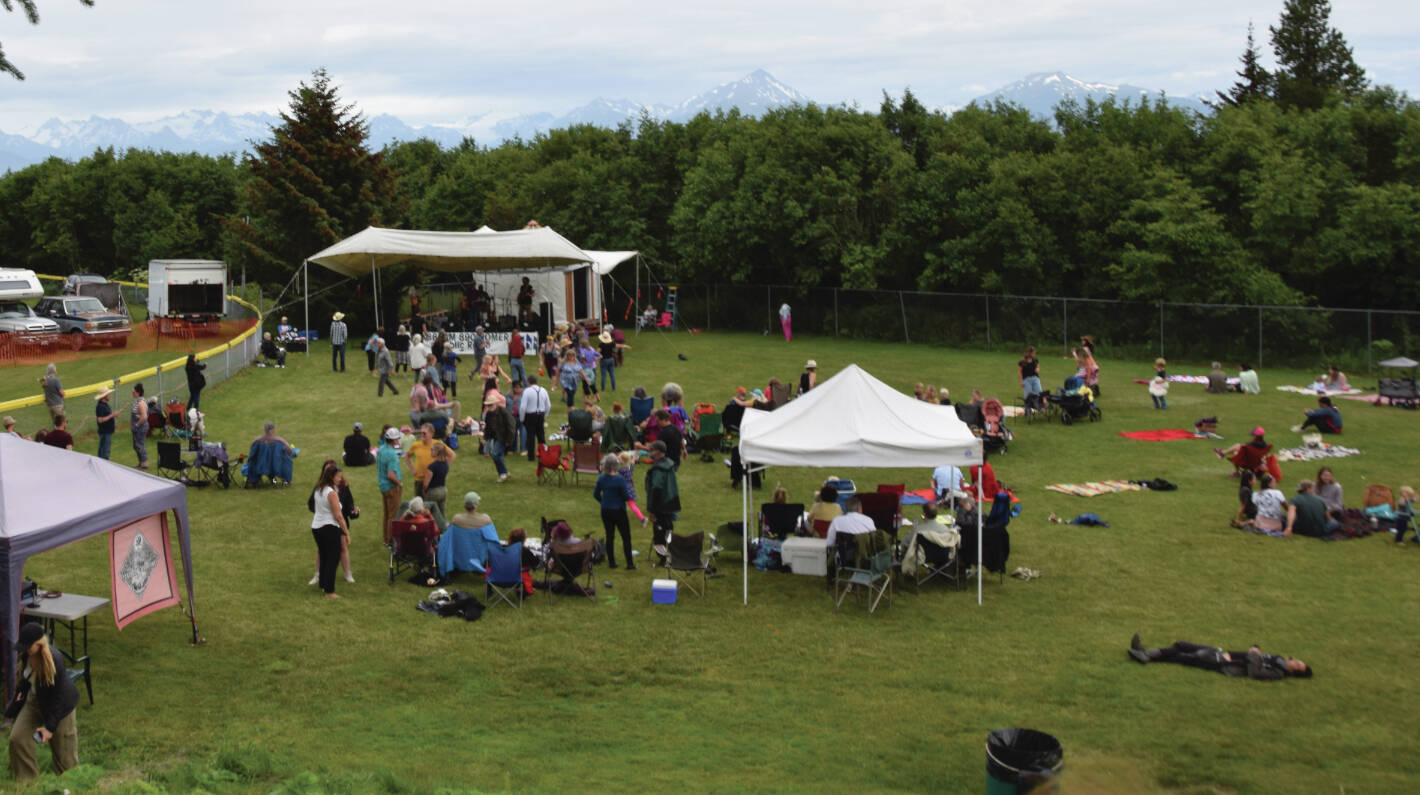 Audience members relax in the sun in the final hour of the Concert on the Lawn at Karen Hornaday Park on Saturday, July 20, 2024, in Homer, Alaska. Emilie Springer/ Homer News.