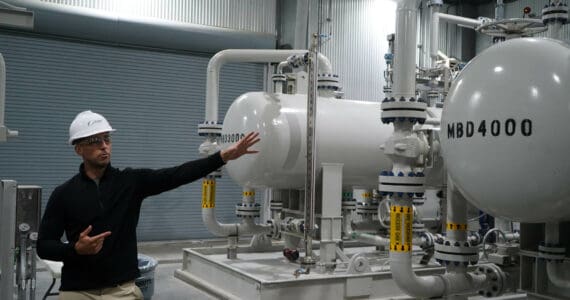 Furie Operations Superintendent Ben Christianson shows off natural gas processing equipment at Furie Operating Alaska’s central processing facility in Nikiski, Alaska, on Wednesday, July 10, 2024. (Jake Dye/Peninsula Clarion)