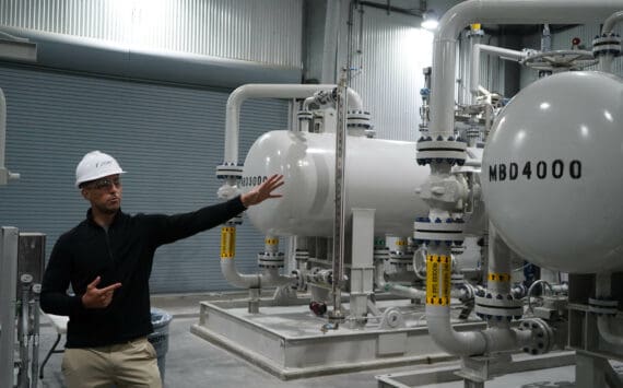 Furie Operations Superintendent Ben Christianson shows off natural gas processing equipment at Furie Operating Alaska’s central processing facility in Nikiski, Alaska, on Wednesday, July 10, 2024. (Jake Dye/Peninsula Clarion)