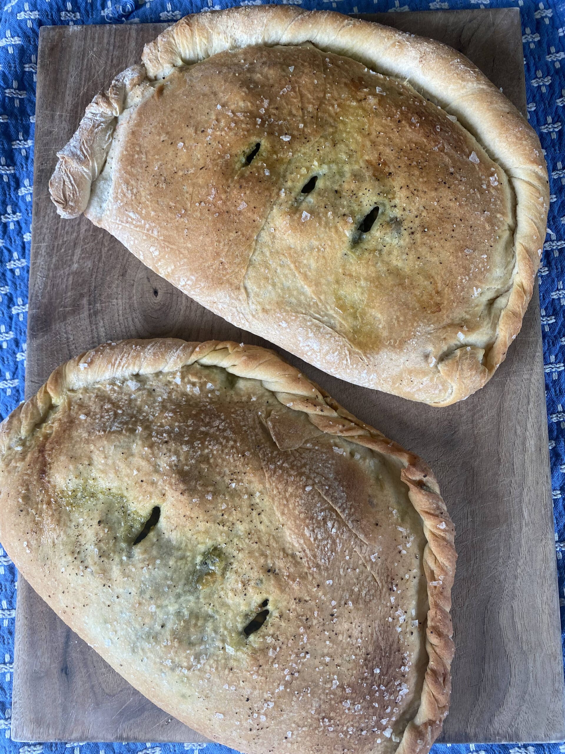 Calzones stuffed with arugula pesto and cheese make for a fun summer meal. (Photo by Tressa Dale/Peninsula Clarion)