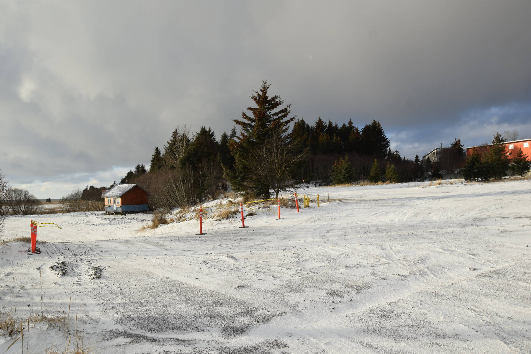 The former Lighthouse Village property, now owned by Doyon Inc. and the proposed site for the construction of a large hotel complex, is photographed on Friday, Dec. 8, 2023 in Homer, Alaska. (Delcenia Cosman/Homer News)