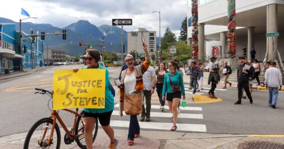 Participants in a Sunday protest for Steven Kissack march toward Marine Park on Sunday. (Jasz Garrett / Juneau Empire)