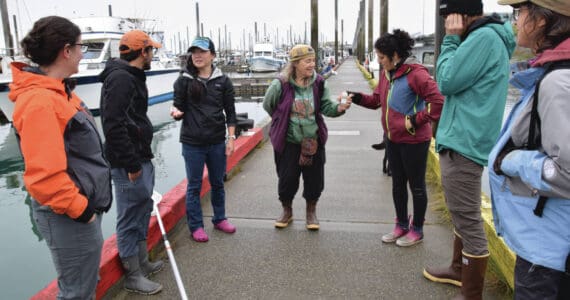 Emilie Springer/ Homer News
Participants from the Kachemak Bay Research Reserve’s eDNA workshop collect water samples from Homer Harbor on Friday, July 26.