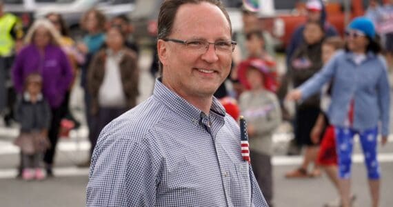 Rep. Ben Carpenter, R-Nikiski, walks down the Kenai Spur Highway in Kenai, Alaska, during the Fourth of July Parade on Thursday, July 4, 2024. (Jake Dye/Peninsula Clarion)