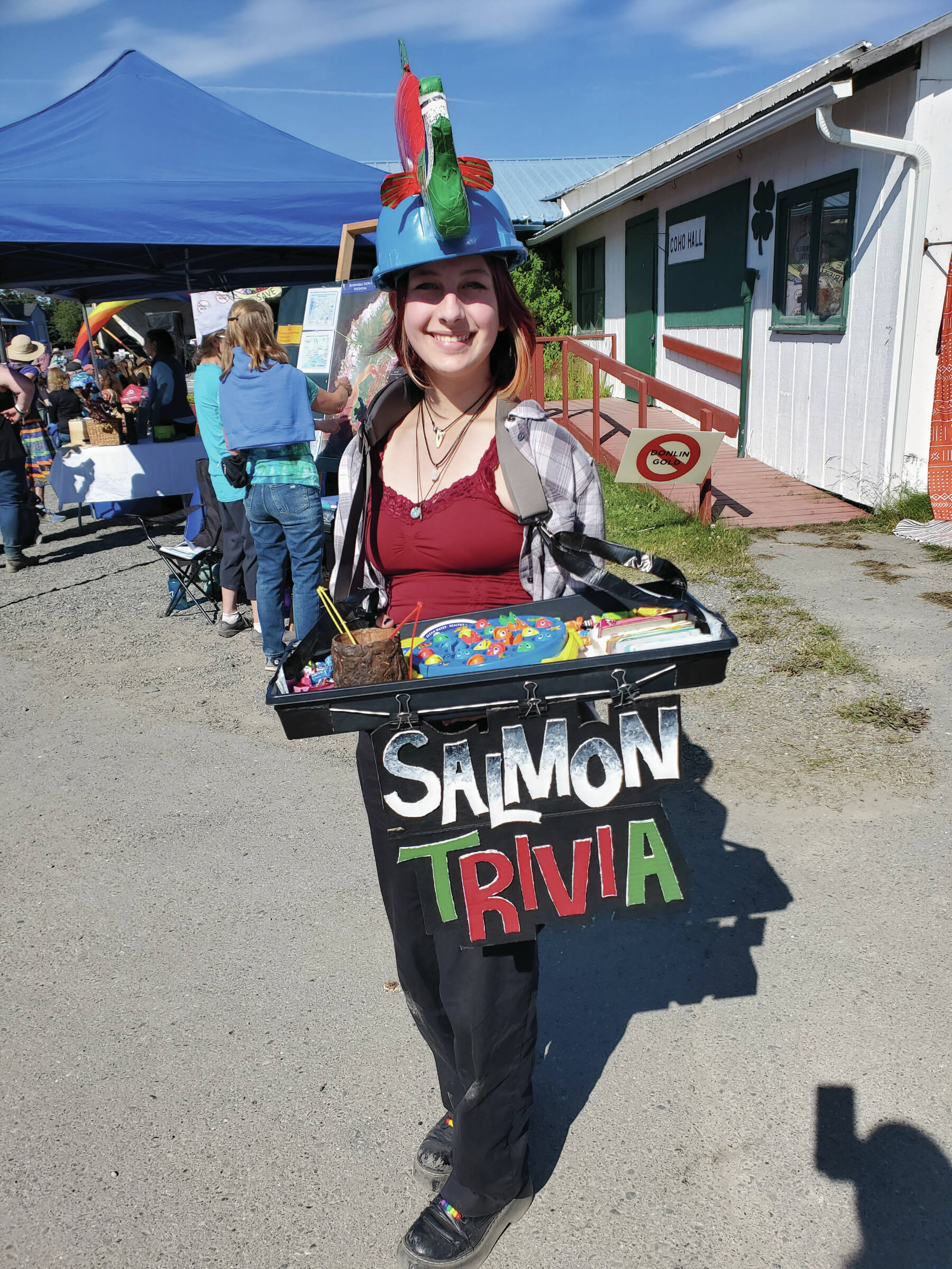 Caroline Gatling with Cook Inletkeeper educates festival-goers on salmon trivia during Salmonfest on Sunday, Aug. 4<ins>,</ins><ins> 2024,</ins> in Ninilchik<ins>,</ins> <ins>Alaska</ins>. (Delcenia Cosman/Homer News)