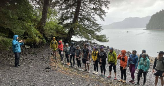 Kathy Sarns (left) speaks to the Kachemak Bay Mountain Classic participants before the start of the event on Saturday, Aug. 10, 2024, at the South Grace Trail head in Kachemak Bay State Park, Alaska. Photo courtesy of Kathy Sarns