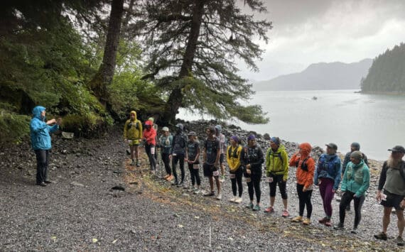 Kathy Sarns (left) speaks to the Kachemak Bay Mountain Classic participants before the start of the event on Saturday, Aug. 10, 2024, at the South Grace Trail head in Kachemak Bay State Park, Alaska. Photo courtesy of Kathy Sarns