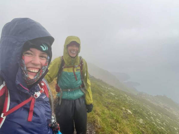 Tania Spurkland and Emma Beeler take a selfie near the top of Grace Ridge in gale-force winds and rain during the Kachemak Bay Mountain Classic on Saturday, Aug. 10, 2024 in Kachemak Bay State Park, Alaska. Photo courtesy of Kathy Sarns