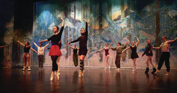 Left to right: Nutcracker ballet performers Aria Palma, Jaelynn Kennon, Tiya Martushev, Talli Dalke, Ireland Styvar, Sofia Loboy and Ella Gustafson rehearse the “Snow” dance onstage at the Homer High School Mariner Theatre on Sunday, Nov. 19, 2023, in Homer, Alaska. (Photo by Chris Kincaid/courtesy)