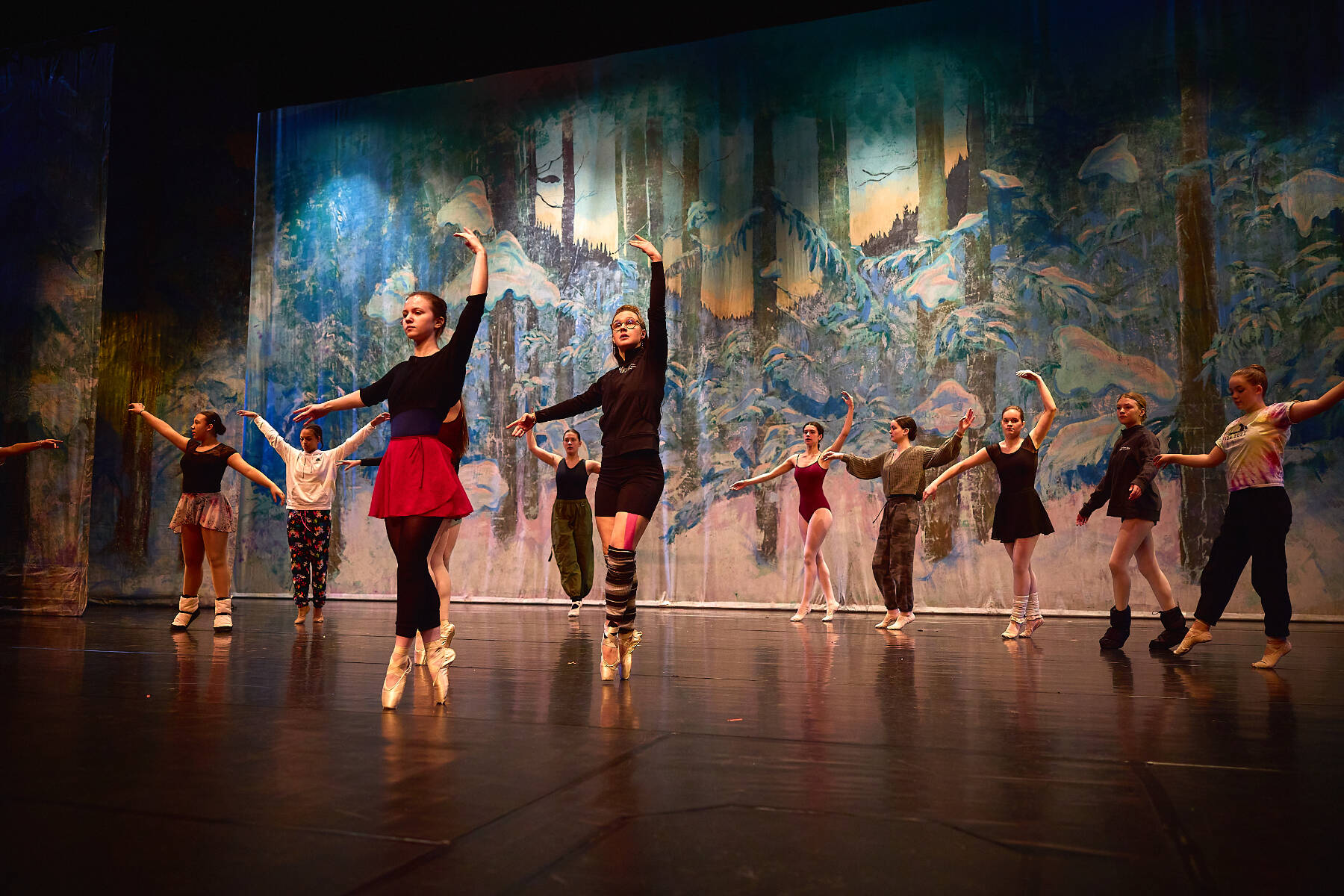 (from left to right) Nutcracker ballet performers Aria Palma, Jaelynn Kennon, Tiya Martushev, Talli Dalke, Ireland Styvar, Sofia Loboy and Ella Gustafson rehearse the “Snow” dance onstage at the Homer High School Mariner Theatre on Sunday, Nov. 19, 2023 in Homer, Alaska. Photo by Chris Kincaid