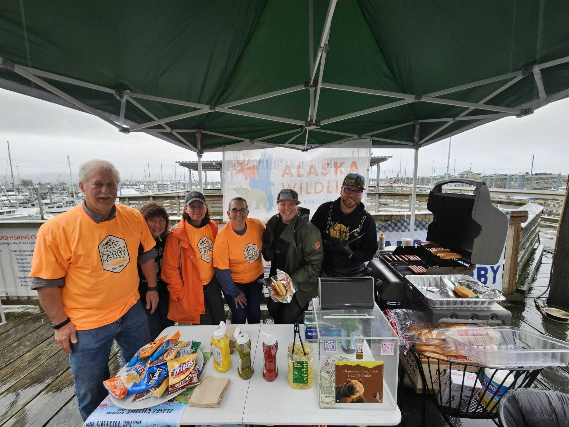 Seward Silver Salmon Derby staff gather for a photo between slinging hot dogs. (Photo provided by Seward Chamber of Commerce)