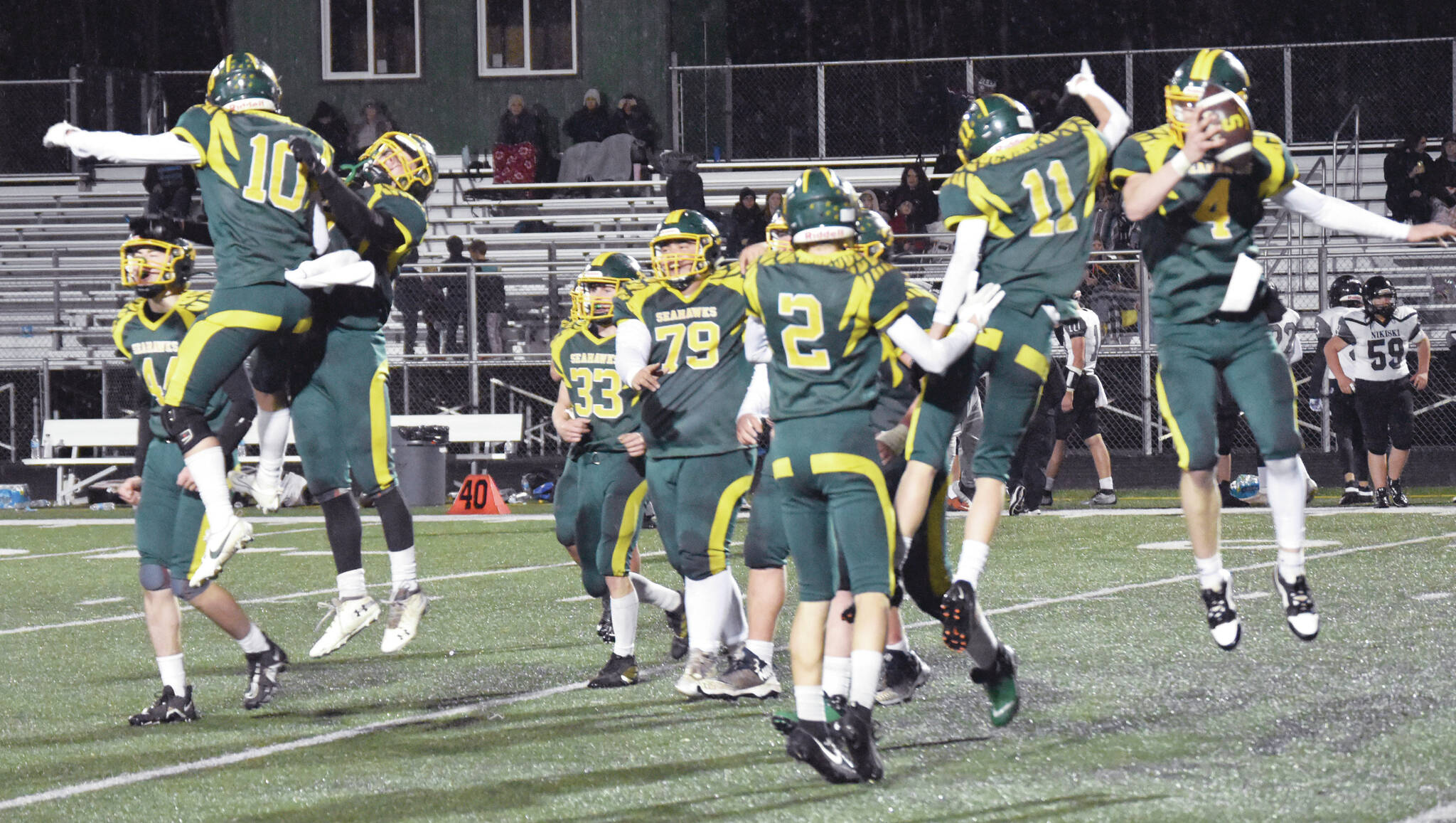 Seward celebrates defeating Nikiski on Saturday, Oct. 7, 2023, in the nine-man football state final at Colony High School in Palmer, Alaska. (Photo by Jeff Helminiak/Peninsula Clarion)