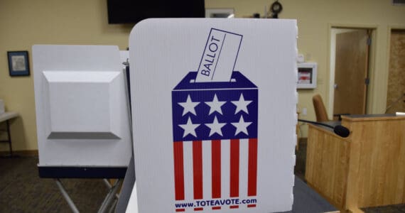 A voting booth for the Kenai Peninsula Borough and City of Homer elections at Cowles Council Chambers on Tuesday, Oct. 4, 2022 in Homer, Alaska. (Photo by Charlie Menke/ Homer News)