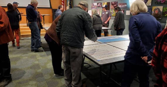 Attendees of the Comprehensive Plan Open House note where they want to see future growth in Homer’s economy on Thursday, March 28, 2024 at the Alaska Maritime National Wildlife Refuge Visitor Center auditorium in Homer, Alaska. (Delcenia Cosman/Homer News)