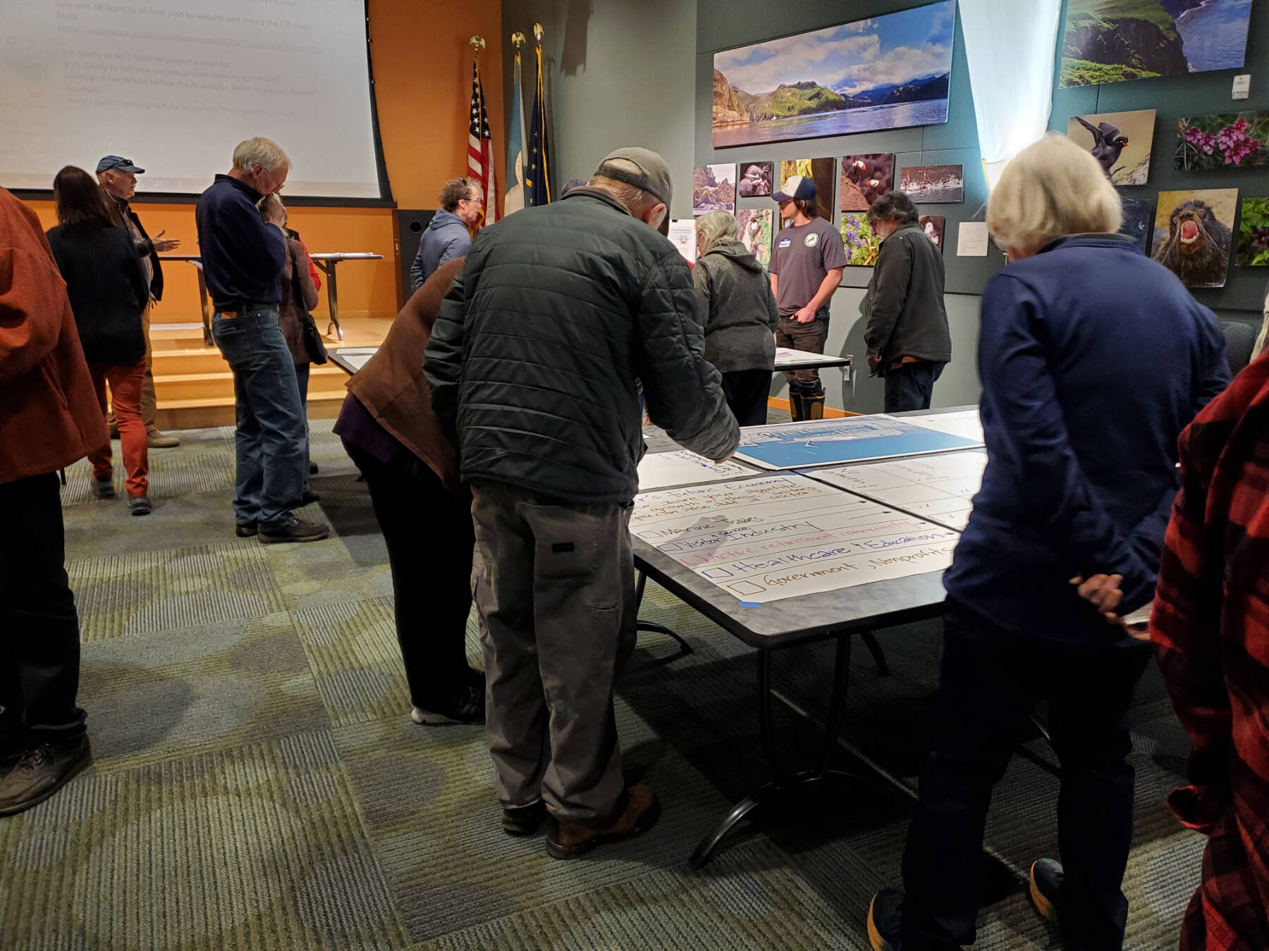 Attendees of the Comprehensive Plan Open House note where they want to see future growth in Homer’s economy on Thursday, March 28, 2024 at the Alaska Maritime National Wildlife Refuge Visitor Center auditorium in Homer, Alaska. (Delcenia Cosman/Homer News)