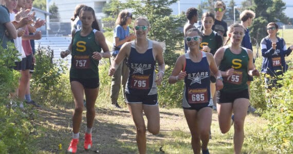 Seward’s Olive Jordan, Soldotna’s Kathryn DeBardelaben, Soldotna’s Kathryn Cox and Seward’s Selah Brueckner compete in the freshmen-sophomore girls race Monday, Aug. 19, 2024, at Nikiski Middle-High School at the Peninsula Class Races in Nikiski, Alaska. (Photo by Jeff Helminiak/Peninsula Clarion)