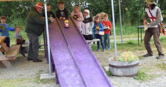 Kids race their handcrafted zucchini cars during the Zucchini Festival at the Homer Farmers Market on Saturday, Aug. 24, 2024, in Homer, Alaska. (Delcenia Cosman/Homer News)