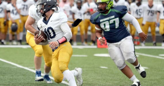 Homer’s Preston Stanislaw carries the ball against Redington on Friday, Aug. 23, 2024, in Wasilla, Alaska. (Photo courtesy of Bruce Eggleston/matsusports.net)