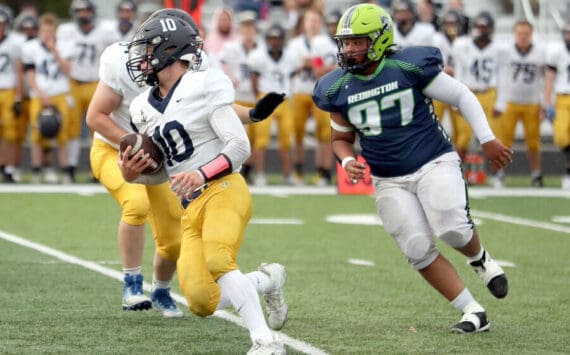 Homer’s Preston Stanislaw carries the ball against Redington on Friday, Aug. 23, 2024, in Wasilla, Alaska. (Photo courtesy of Bruce Eggleston/matsusports.net)