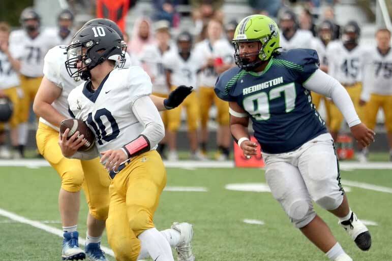 Homer's Preston Stanislaw carries the ball against Redington on Friday, Aug. 23, 2024, in Wasilla, Alaska. (Photo courtesy of Bruce Eggleston/matsusports.net)