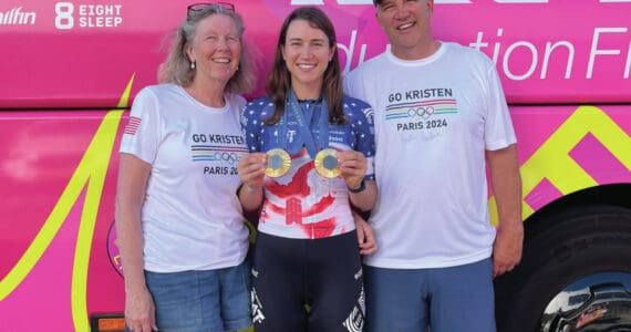 From left: Sara, Kristen and Jon Faulkner pose with Kristen's two gold medals at the 2024 Olympics in Paris, France. (Photo provided by Jon Faulkner)