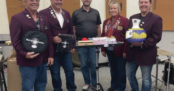 Left to right: Elks member Robert “Lenny” Euberts, Matthew Hockema, Homer High School band instructor Eric Simondsen, Lodge Exalted Ruler Jill Hockema and Heather Turner present instruments donated by Homer Elks Lodge #2127 to Homer High School on Aug. 30, 2024. (Emilie Springer/Homer News)