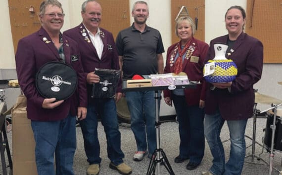 Left to right: Elks member Robert “Lenny” Euberts, Matthew Hockema, Homer High School band instructor Eric Simondsen, Lodge Exalted Ruler Jill Hockema and Heather Turner present instruments donated by Homer Elks Lodge #2127 to Homer High School on Aug. 30, 2024. (Emilie Springer/Homer News)