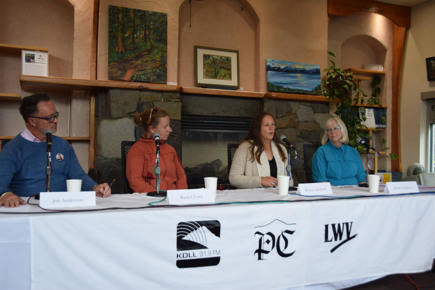 (from left to right) Homer city mayoral candidates Jim Anderson and Rachel Lord and incumbent city council candidates Donna Aderhold and Shelly Erickson answer questions during a forum held on Thursday, Aug. 29, 2024, in the Homer Public Library Fireplace Lounge in Homer, Alaska. (Delcenia Cosman/Homer News)