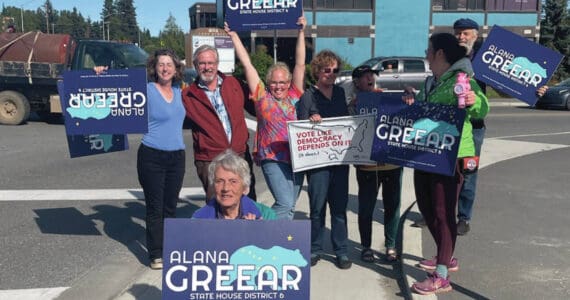 Alaska House District 6 candidate Alana Greear (back, center) poses with supporters at the corner of Pioneer Avenue and Lake Street in Homer during the primary election on Aug. 20, 2024. (Emilie Springer/Homer New)