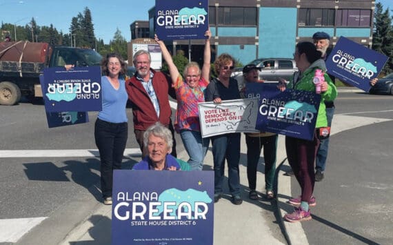 Alaska House District 6 candidate Alana Greear (back, center) poses with supporters at the corner of Pioneer Avenue and Lake Street in Homer during the primary election on Aug. 20, 2024. (Emilie Springer/Homer New)