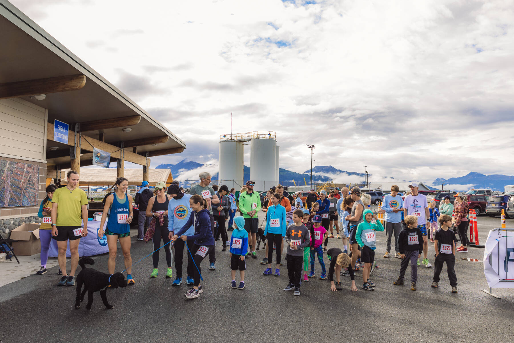 Participants in the second annual 5K Run for Recovery gather at the starting line at the Deep Water Dock on the Homer Spit on Saturday, Aug. 31, 2024 in Homer, Alaska. Photo by Andrew Tomey