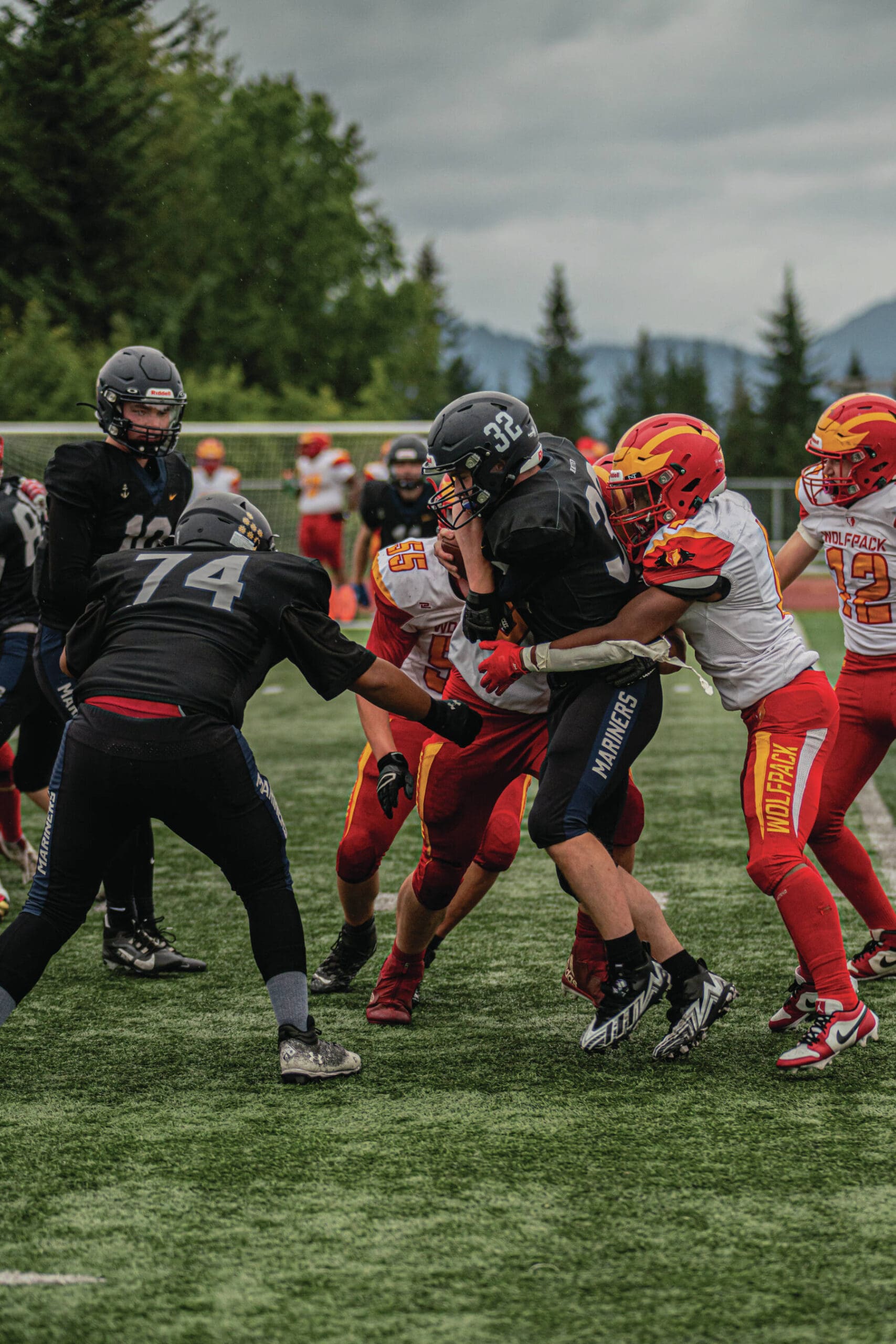 Photo provided by Wilhelm Hakala/Homer High School yearbook staff
Homer High School Mariner varsity football player Jackson Snaric, junior, returns a kickoff during the Friday, Aug. 30 bout against the visiting Fairbanks West Valley Wolfpack on the Mariner field in Homer. He is assisted by junior Ellington Dudley.