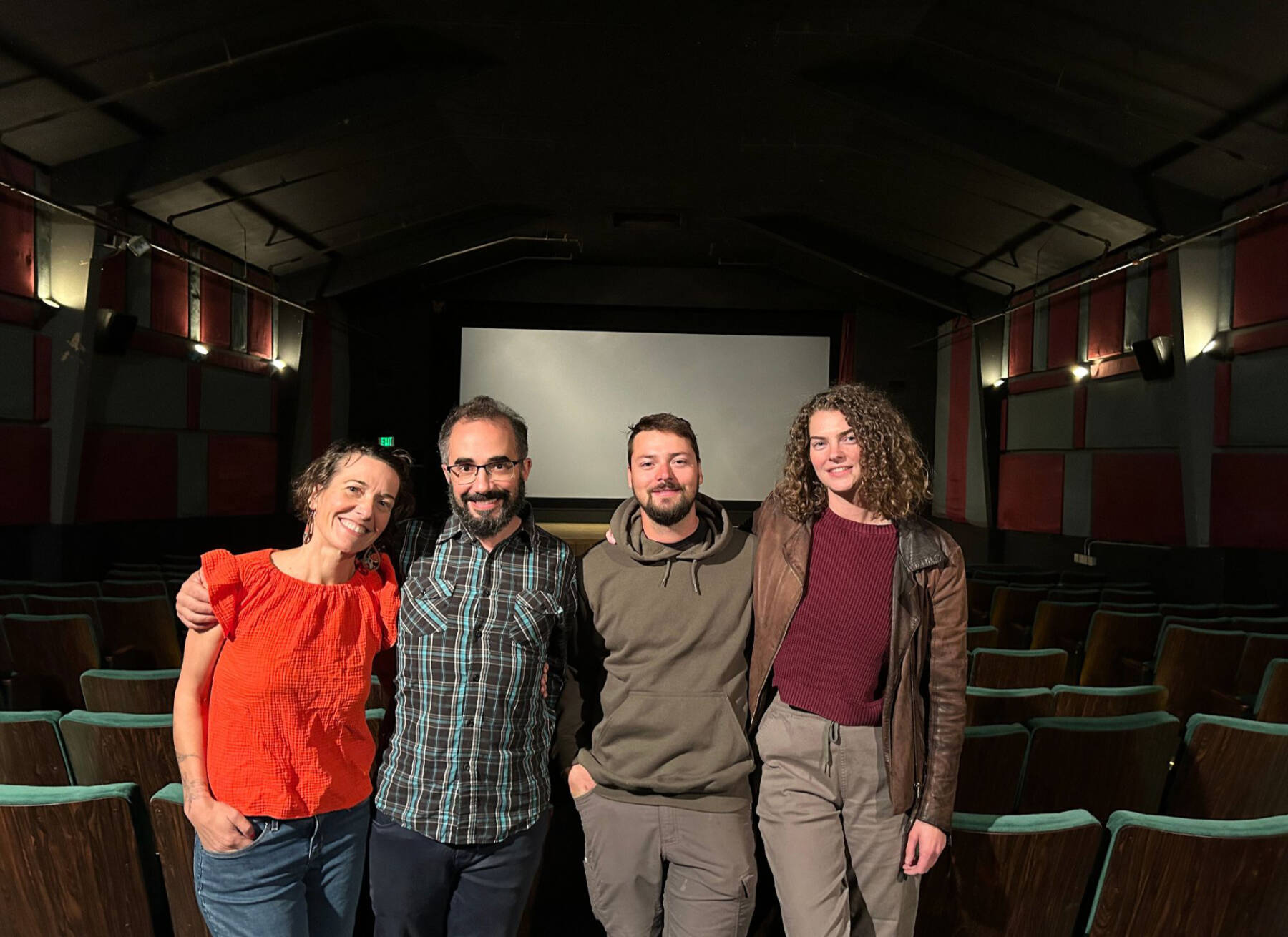 (from left to right) Susannah Webster, Nate Spence-Chorman, Baldur Neumann-Hunting and Rosanna Hunting pose for a group photo in the Homer Theatre on Thursday, Aug. 29, 2024, in Homer, Alaska. Photo by Colleen Carroll