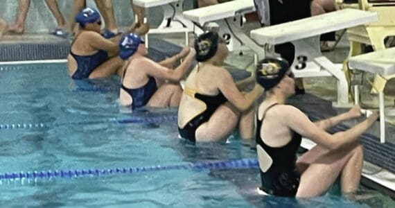 Photo by Emilie Springer/Homer News
Mariner swim team members Cassidy Carroll and Avery Briscoe prepare for the 100-yard backstroke at the Mariner pool on Sept. 7, 2024, in Homer, Alaska.