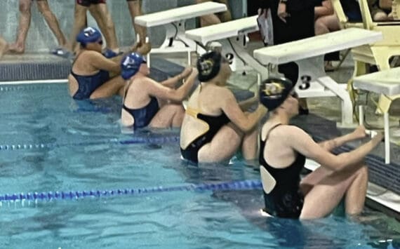 Photo by Emilie Springer/Homer News
Mariner swim team members Cassidy Carroll and Avery Briscoe prepare for the 100-yard backstroke at the Mariner pool on Sept. 7, 2024, in Homer, Alaska.