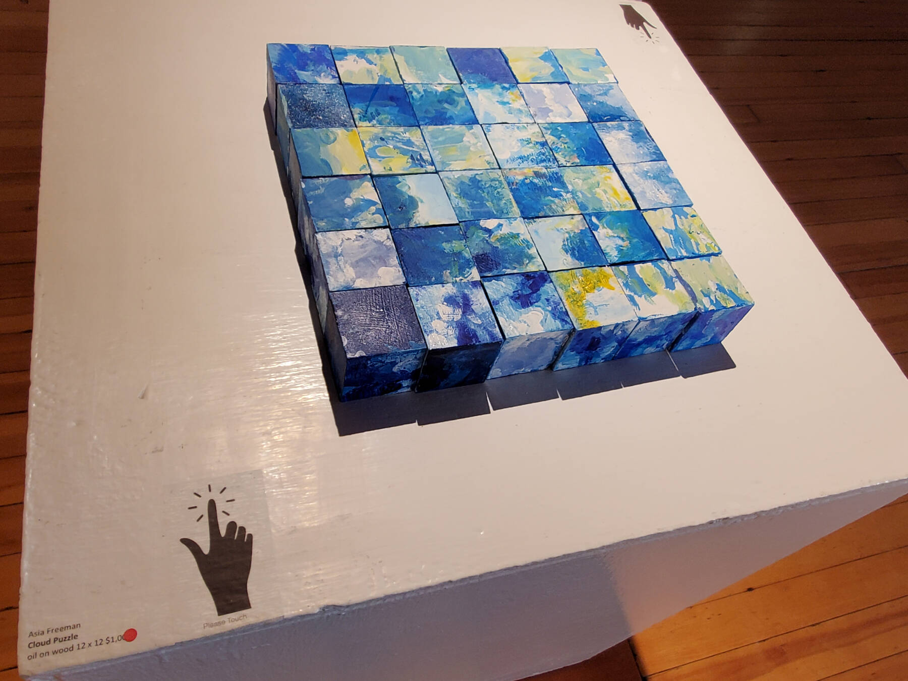 “Cloud Puzzle,” an interactive art installment made from oil paints on wood blocks, is on display at Bunnell Street Arts Center on Saturday, Sept. 7, 2024, in Homer, Alaska. (Delcenia Cosman/Homer News)